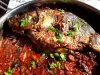 Stuffed Carp with Tomatoes and Onions