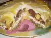 Šarena torta sa belim kremom i glazurom od pomorandže