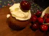Chocolate Cupcakes with Cherries and Cream Cheese Glaze