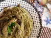 Spaghetti met champignons en pesto